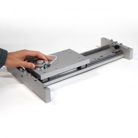 Dual rail slide table with controlled release braking system